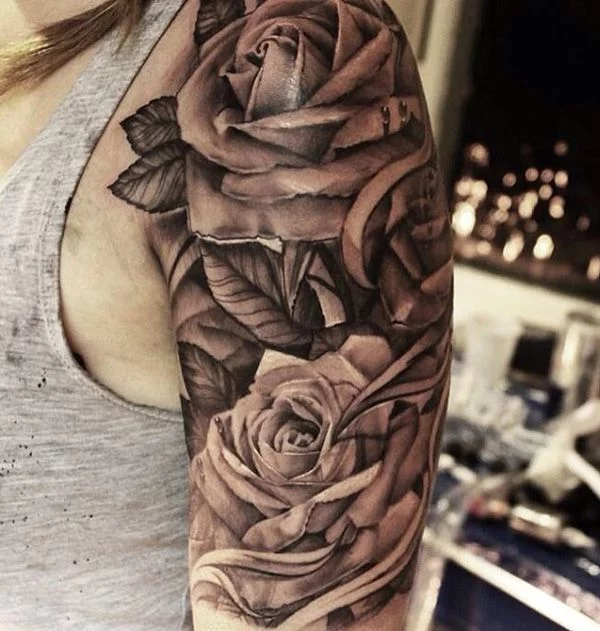 Black rose tattoo on the right upper arm