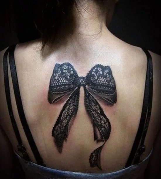 Black and white shaded bow tattoo on the center back  Bow tattoo Tattoos  Tattoos and piercings