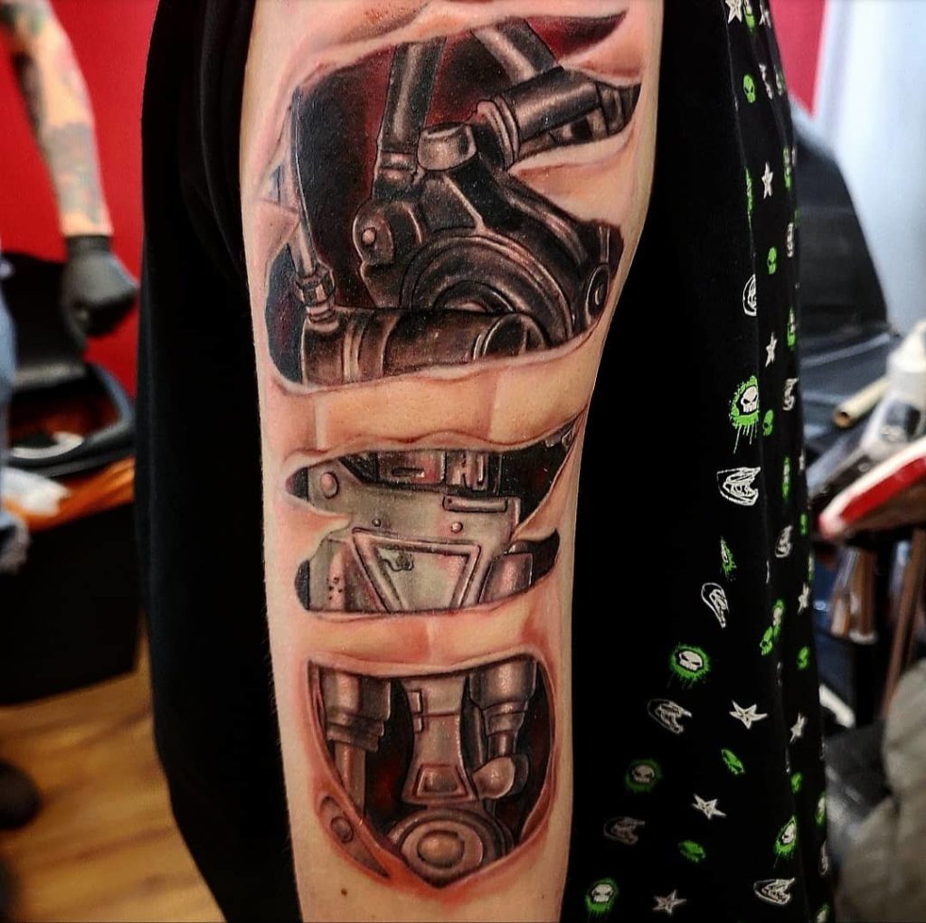 Premium Photo | A tattoo of a man with a green cyborg on his arm.