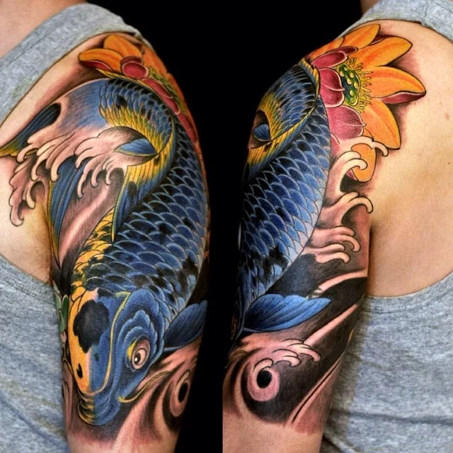 Blue Ink Koi Fish Tattoo On Man Right Half Sleeve