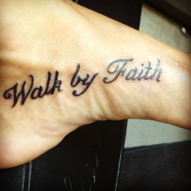 Walk By Faith text With Cross Tattoo On Foot